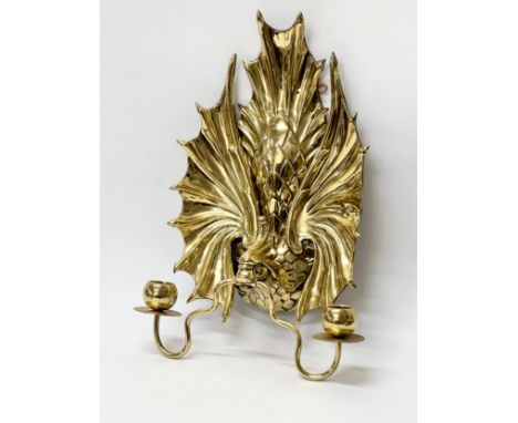 A Late 19th Century brass peacock wall sconce/candleholder. 27x41cm.