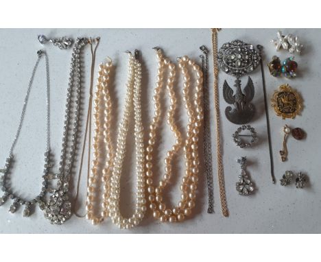 A quantity of vintage costume jewellery to include simulated pearl necklaces A/F, a Polish army cap badge and paste stone ite
