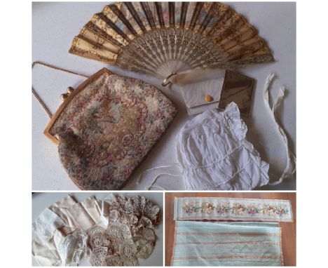 A 19th Century mother of pearl wand and cream silk fan decorated with embroidery, sequins and images of a music room with mus
