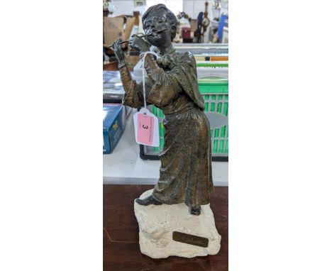 A bronze composite figure of a young boy playing (possibly) the flute on a naturalistic base, signed L M Lafuente, 30cm h, an