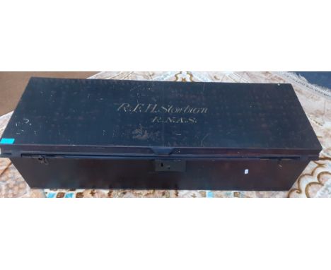 A late 19th/early 20th Century military trunk with red flecks, inscription to lid R.F.H Stowbron R.N.A.S, approx 42" wide x 1
