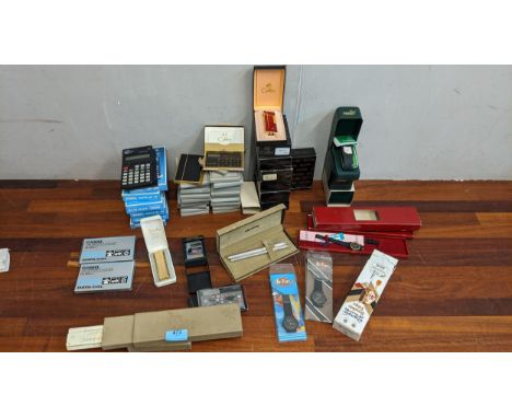 As new, Calibri card cases with calculators, lighters, Puma watches, a Flexika cigarette lighter, pens, Lee Cooper watches, a
