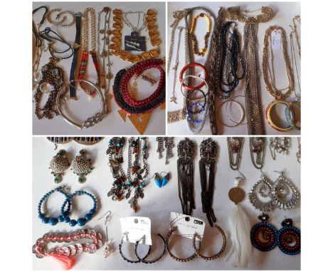 A quantity of costume jewellery to include over-sized earrings, silver and turquoise earrings, costume rings, silver tone and