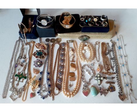 A quantity of vintage costume jewellery to include a 9ct gold locket stamped 375, 1.9g, gold tone and silver tone chains, a r