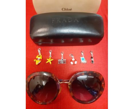 Prada-A pair of vintage over-sized sunglasses with mock tortoiseshell frame, gold tone and purple temples and purple ombre le