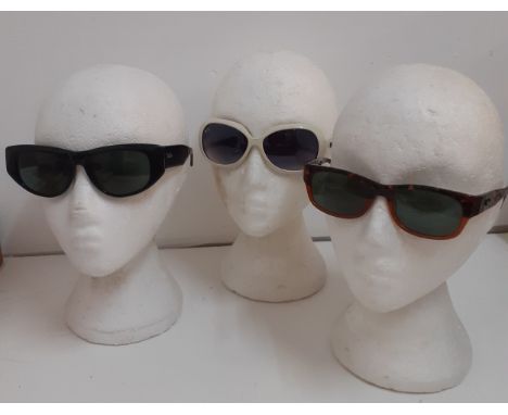 Ray Ban-Three pairs of vintage sunglasses comprising a pair of black 'Dekko' sunglasses, a pair of white large lens Onassis s