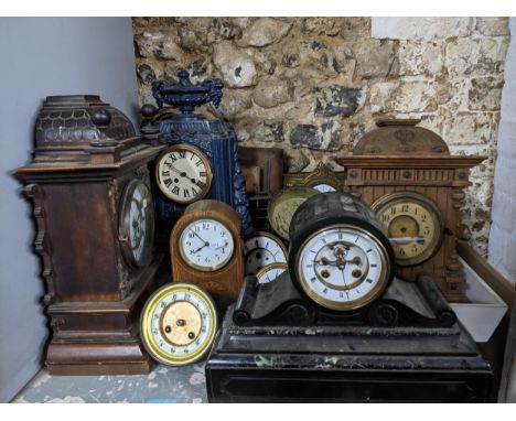 A group of Victorian and later mantle clocks to include one housed in a blue painted cast iron clock, black slate cased clock