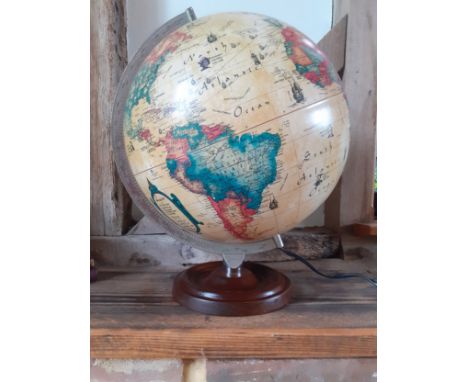 A 1992 Danish Scan-Globe Legend World Discoverer light-up globe, pat-tested, having a wooden base and chrome coloured support