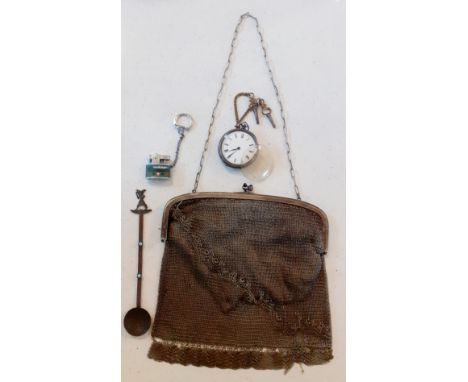 An early 20th Century white metal chain bag A/F with acorn style fastening, a copper coloured teaspoon with Egyptian design a