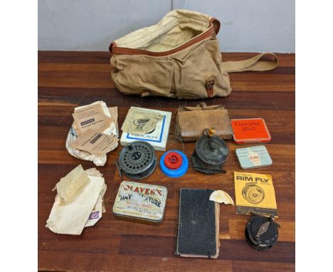 Fishing equipment to include vintage reels, waterproof silk line, flies and other items in a hessian catcherLocation:If there