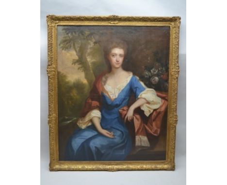 IN THE MANNER OF MICHAEL DAHL (1656-1743) A three-quarter length portrait of a Lady, seated within a romantic parkland scape,