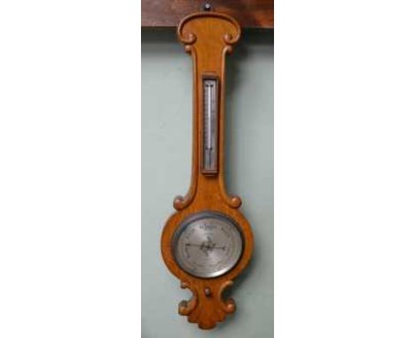 NEGRETTI &amp; ZAMBRA OF LONDON A MAHOGANY CASED WHEEL BAROMETER with 20cm silvered dial, fitted thermometer to neck, overall