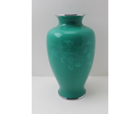 A BALUSTER SHAPE CERAMIC VASE, jade green glaze with trailing floral design, having polished metal base and mouth rims, 19cm 