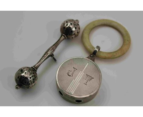 G. UNITE AND SONS AND LYDE LTD AN ART DECO SILVER BABY'S RATTLE of drum form with engine turned decoration, monogrammed "JT",