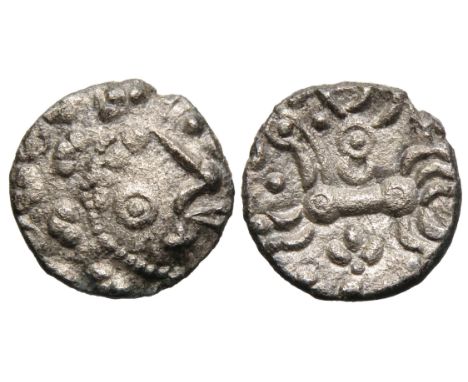 Dobunni silver unit, Cotswold Eagle type, head type B. Obv: moon head right, pelleted crescents for hair, large boss on chin,