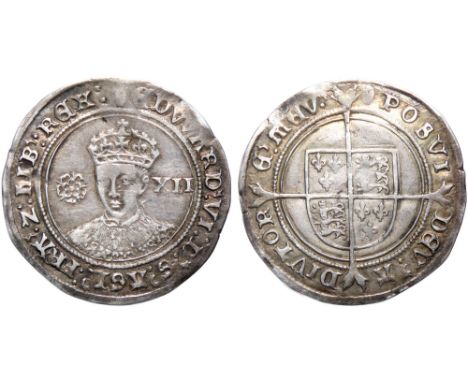 Edward VI Shilling. Fine silver issue, 1551-3 AD. 6.07g. 38mm. Crowned facing bust, rose left, XII mark of value right. EDWAR