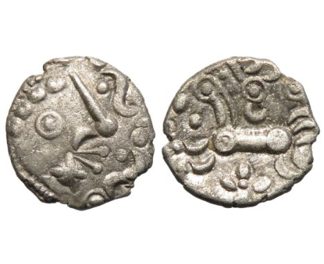 Dobunni silver unit, Cotswold Eagle type, head type B. Obv: moon head right, pelleted crescents for hair, large boss on chin,