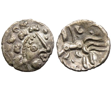 Dobunni silver unit, Cotswold Eagle type, head type B. Obv: moon head right, pelleted crescents for hair, large boss on chin,