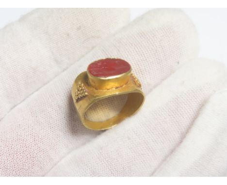Ancient Roman Gold Intaglio Ring. Circa 2nd century CE. 5.37g. 20mm, 16mm internal. Formed of a wide flat gold band, decorate