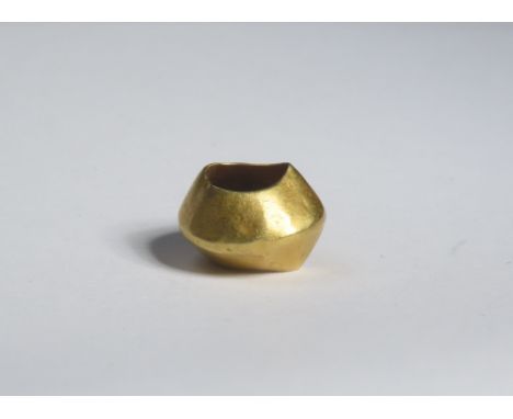 Bronze Age gold bead. Circa 1500-1100 BCE. 0.56g. 10mm. A biconical bead with slightly dished, concave faces and a central ho