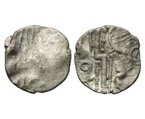 Durotriges silver quarter stater. Circa 1st century BC. Traces of â€˜three men in a boatâ€™ design. R. Thunderbolt flanked by