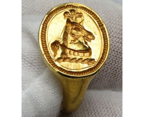 Post-Medieval gold signet ring c. 17th century. Formed of a D-shaped band that widens at the shoulders to meet a flat, oval b