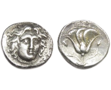 Islands of Caria-Rhodes. 275-250 BC.Â&nbsp;Didrachm. Silver, 6.35g. 21mm.Â&nbsp;Head of Helios facing slightly right. R. Rose
