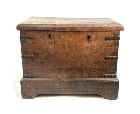 An 'estate made' heavy oak chest, branded HCM, with iron brackets, bracket feet, width 75cm, depth 51cm, height 60cm.