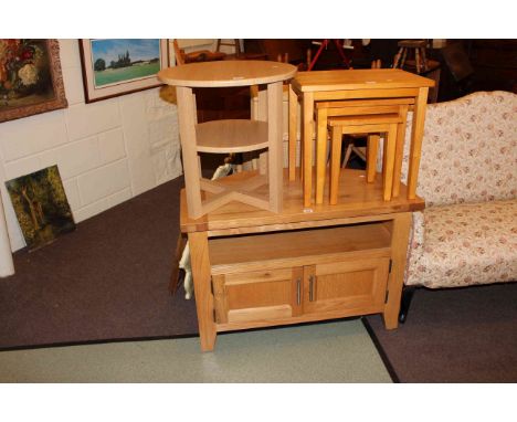 Light oak entertainment stand, circular occasional table and nest of three tables