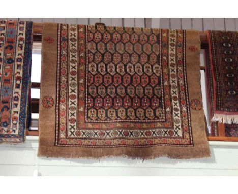 Afshar rug with a light brown ground 2.20 by 1.13