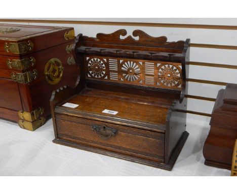 Late 19th century oak smoker's pipe rack with open fretwork brass panel and fitted drawer, 32cm wide 