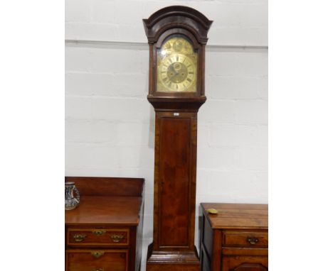 18th century walnut longcase clock with domed hood flanked by columns, the brass dial with subsidiary seconds hand and calend