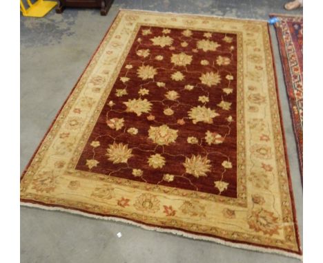 Afghan Ziegler rug having ruby red field with allover trailing flowerheads and ivory border with palmettes and flowerheads, 2