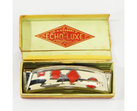 M Hohner Echo-Luxe harmonica, of crescent-shape with cream and red enamel decoration, boxed 