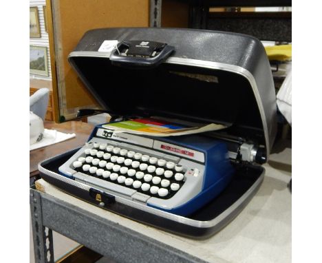 Smith Corona Classic 12 typewriter in original case with original instructions, a cash tin and an Egyptian-style papyrus pain