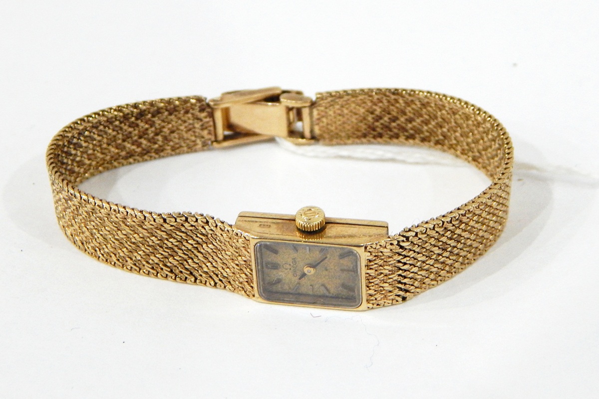 Lady's 9ct gold Omega bracelet watch with square dial, on woven 9ct gold bracelet