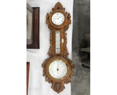 Late Victorian combination barometer within a carved oak case with clock, enamel dial, temperature and pressure gauges, 65cm 