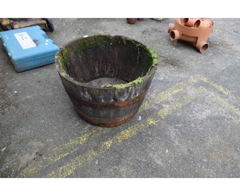 Iron bound wooden half barrel planter