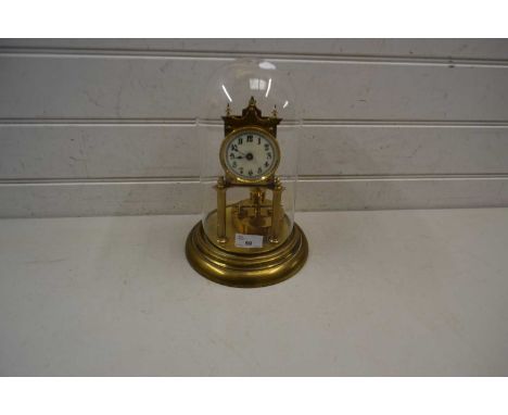 Brass anniversary clock with white dial with Arabic numerals set under a glass dome, 29cm high