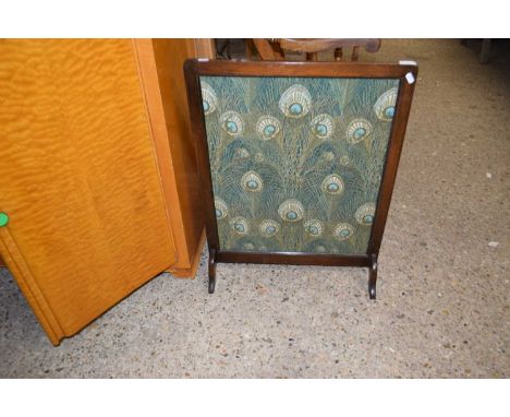 Fire screen decorated with peacock feather fabric