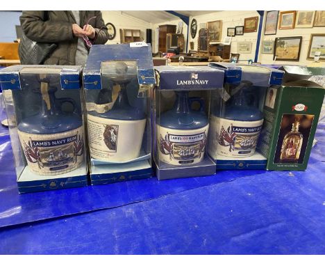 Four boxed sealed Lambs Navy Rum decanters together with a further small decanter. (5)