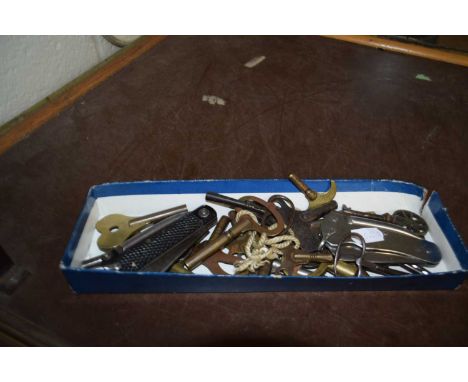 Box of various clock keys and pocket knives