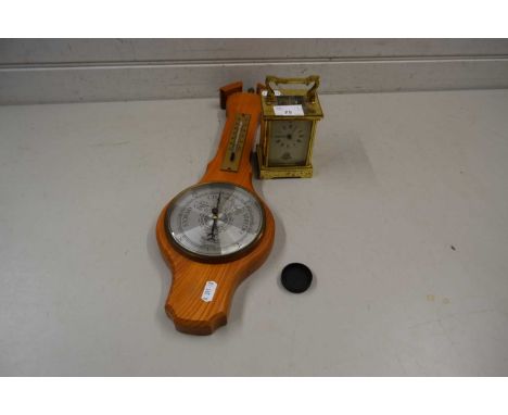 Brass cased carriage clock together with a small barometer