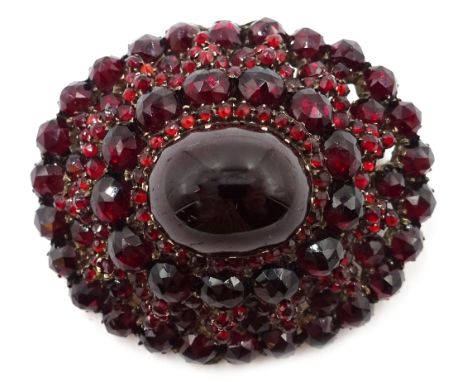 Victorian Bohemian rose gold garnet brooch, set with central cabochon garnet and a surround of rose cut garnets Condition Rep