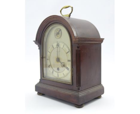 Small late 19th century mahogany bracket clock, stepped arch case with brass carry handle, silvered dial and Roman chapter ri