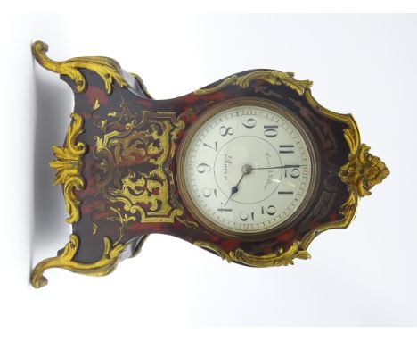 Late 19th century cartouche shaped mantel clock, brass inlay and boulle work, circular Arabic dial signed 'Waring &amp; Gillo