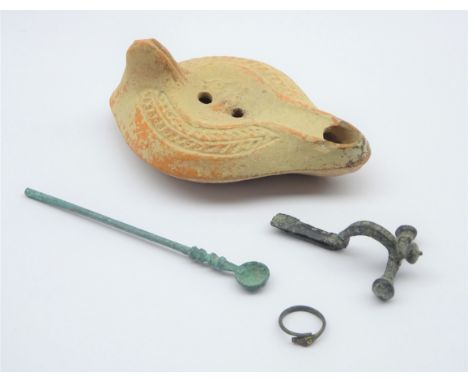 Group of Roman Antiquities; oil lamp with zoomorphic decoration, L14cm, Roman Bronze medicine spoon, Roman crossbox fibula br