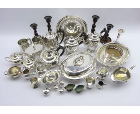 Two four piece silver-plated tea sets, Sheffield plate bottle coaster, silver-plated entree dishes, tea caddy, gravy boats an