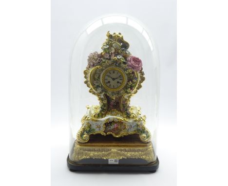 19th century Rococo style porcelain mantel clock, cartouche shaped with hand painted flower head and foliage decoration, on s