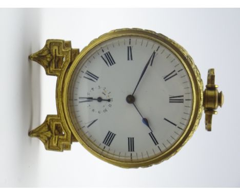 Late 19th century gilt metal circular alarm clock, decorated with two leaf and ribbon bands, canted carrying handle with cart
